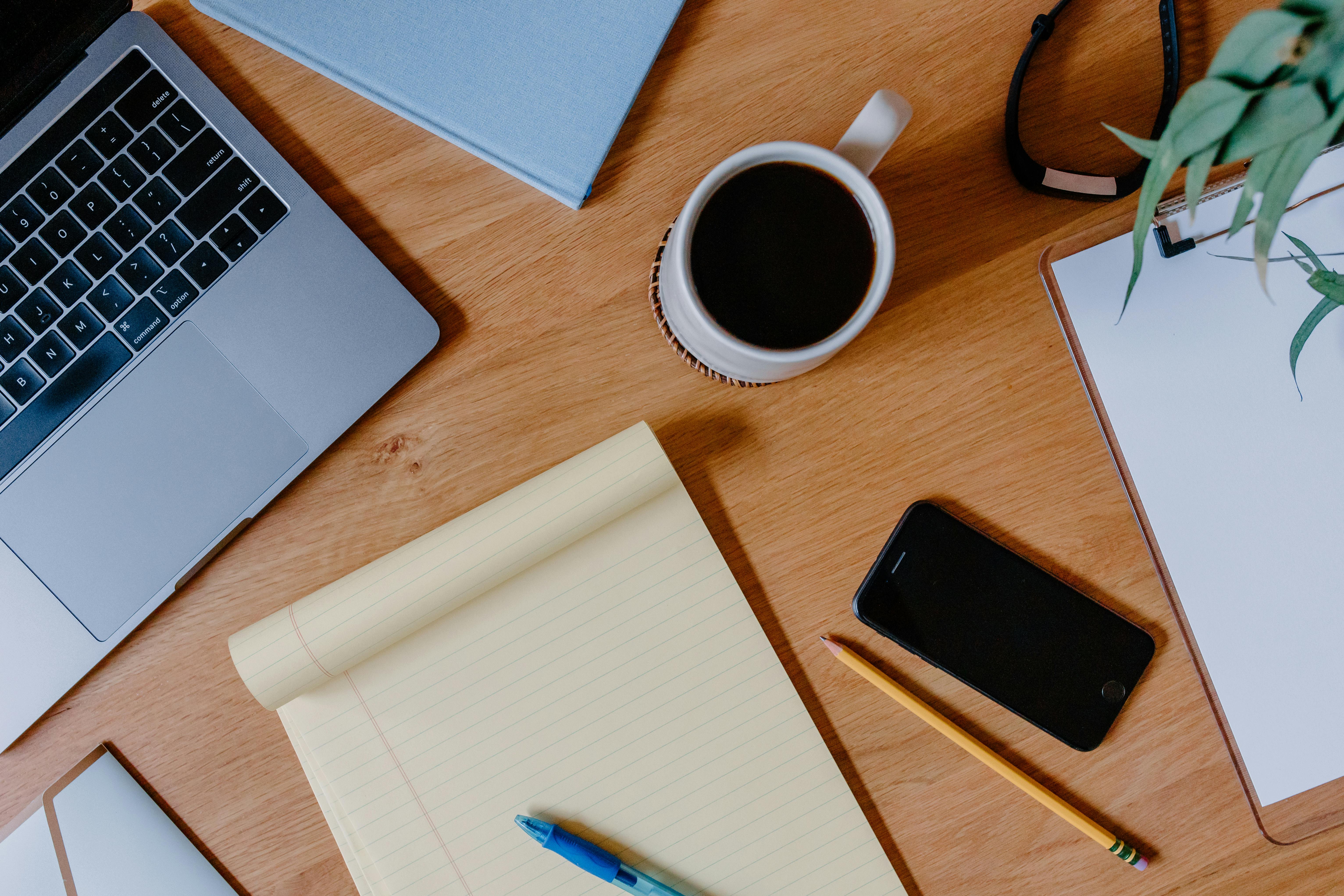Workspace with laptop and notebook